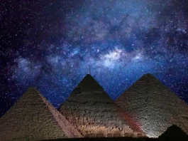 Aerial view of the Great Pyramid under the Milky Way sky symbolizing ancient knowledge and cosmic alignment.