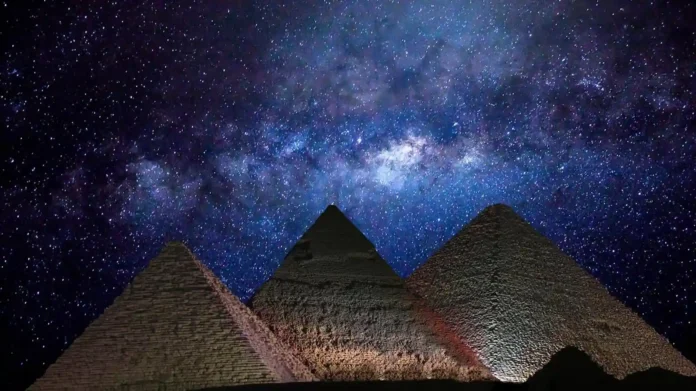 Aerial view of the Great Pyramid under the Milky Way sky symbolizing ancient knowledge and cosmic alignment.